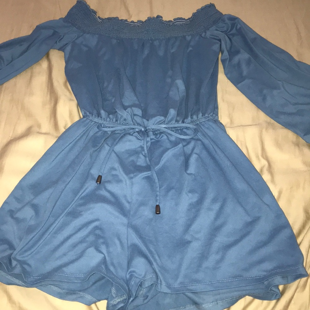 a blue off the shoulder romper